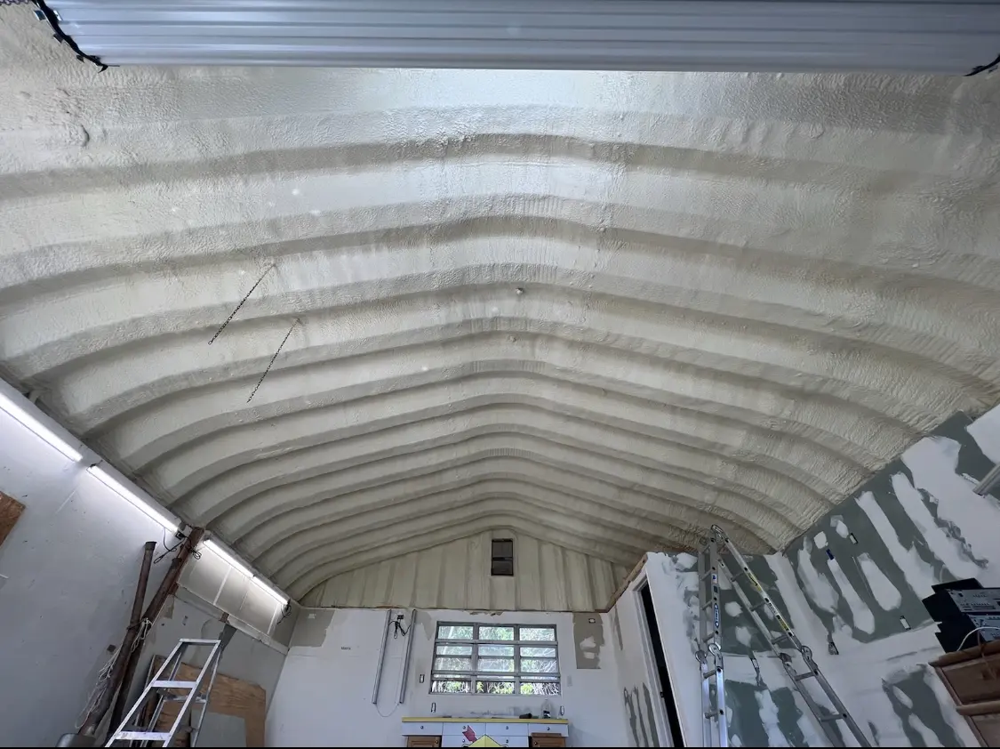 Spray polyurethane foam applied to the underside of a metal roof deck in Rincon Valley